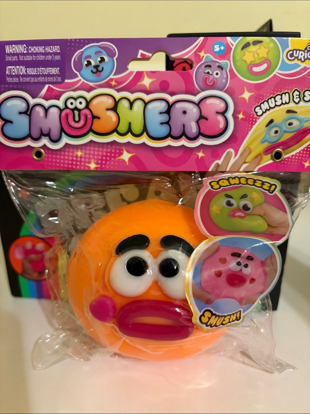 Authentic Orange Smusher Squeeze Face Toy (w/sticker freebie)